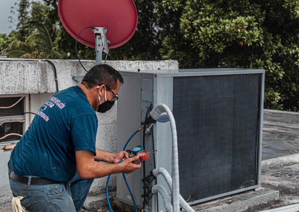 A man working on an Air conditioner